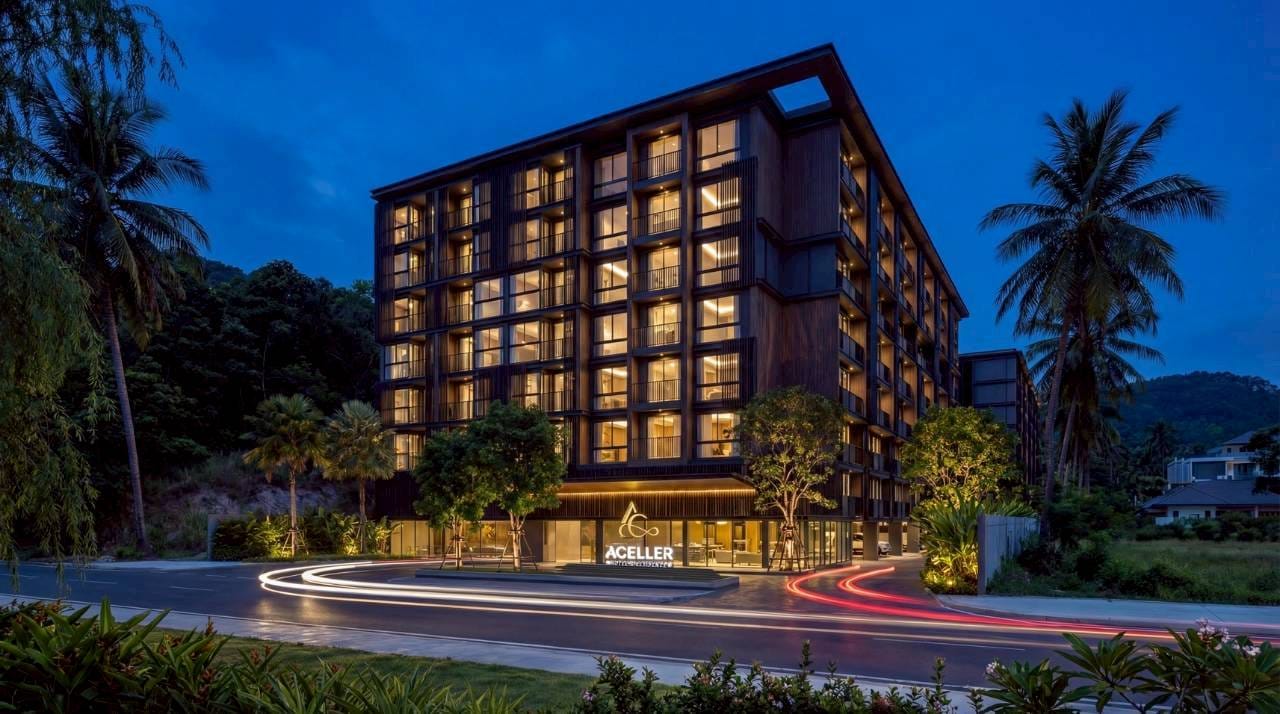 1-Bedroom Condominium for Sale in Chalong, Phuket — Lit entrance facade of the residence at night, Soi Ta-iad